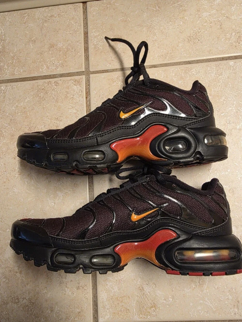 Nike Air Max Plus Black with Red and Yellow Accents